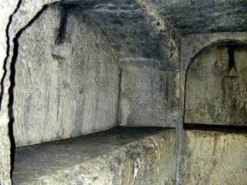 Interior of a 1st century tomb showing stone shelves to hold the bodies