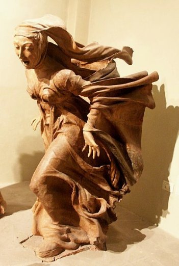 Mary Magdalene running to the disciples to tell them Jesus has risen, Niccolo del Arca, wooden carving, 1462
