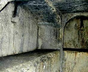 Underground stone tombs from the Tombs of the Kings in Jerusalem. Notice the stone slabs which held the bodies of the dead.